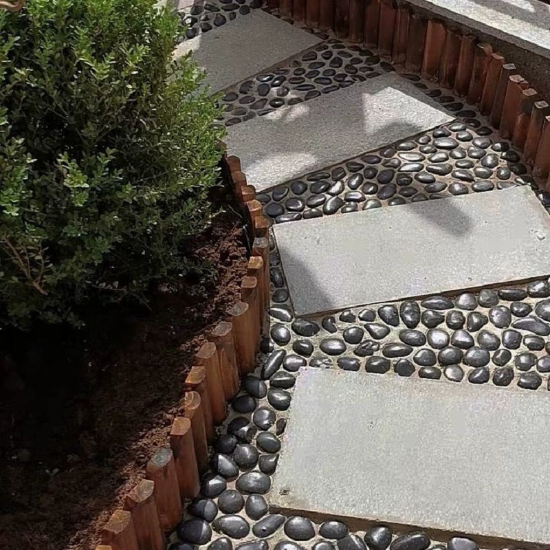 unpolished-black-landscaping-rock-courtyard.jpg